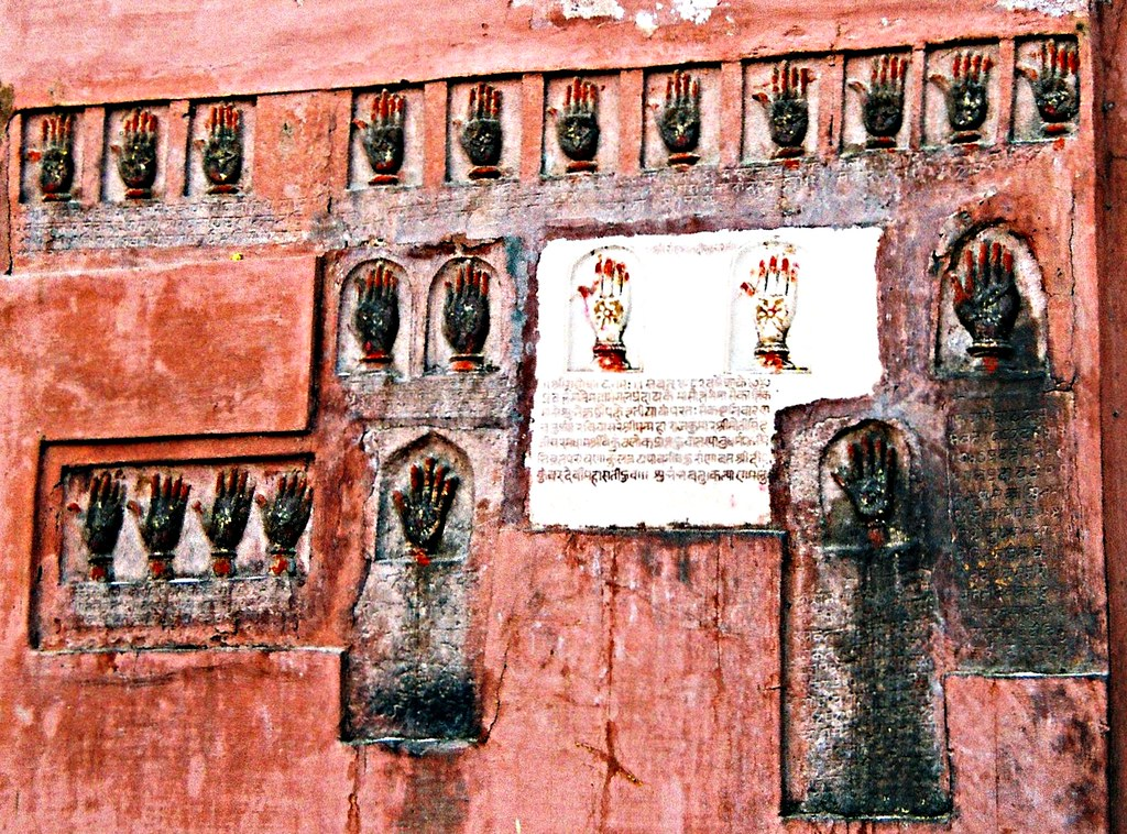 Hand imprints of Sati on the wall of Daulat Pol at Junagarh Fort | Image from Flickr